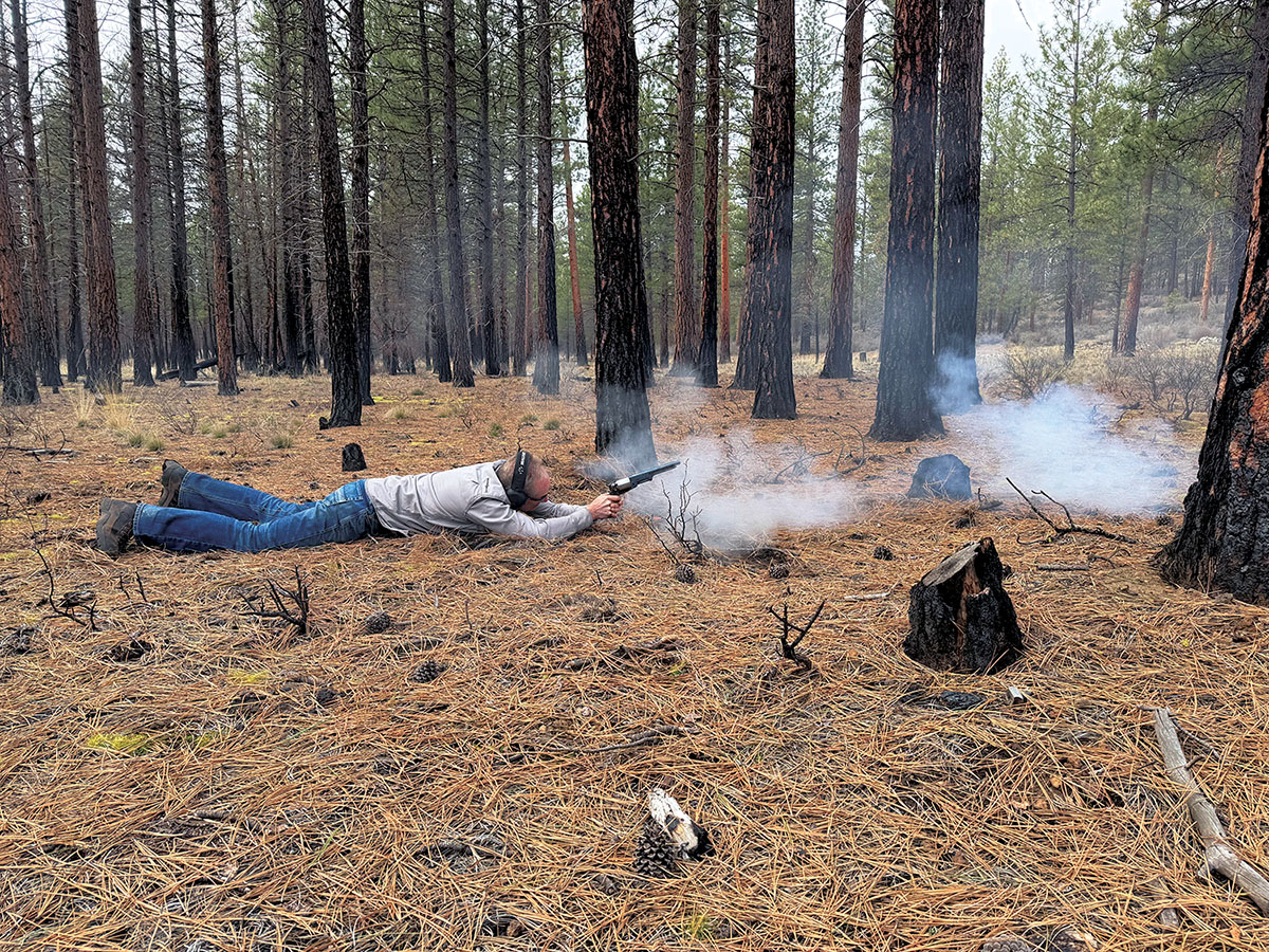 Shooting prone in an old burn. The target was at 100 yards. The powder charge was 45 grains of FFFg and the projectile a .451 lead, roundball weighing  128 grains. The slow-burning black-powder recoil is calm, and the gun is pleasant to shoot. Eye protection is highly recommended.